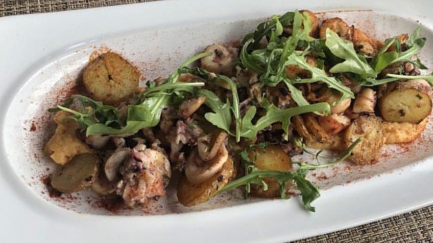 Portuguese Octopus · Fingerling potatoes chickpea puree garlic and olive oil.