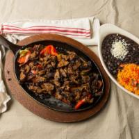 Steak Fajita · with salsa, sour cream, guacamole, rice, black beans, and side of warm corn tortillas.