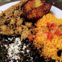 Carnitas · With pork, yellow rice, black beans, and plantains.