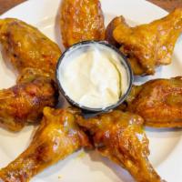 Wings (Seven Pieces) · With mango jerk, buffalo, and lemon pepper.