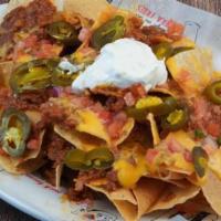 Loaded Nachos · smoked bacon chili, cheddar cheese, sour cream, jalapeno