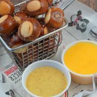 Pretzel Bites · Yellow mustard and cheese sauce