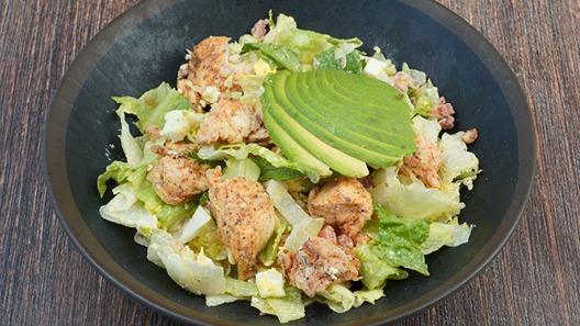Classic Chicken Cobb Salad · grilled chicken, romaine, avocado, egg, applewood bacon, blue cheese tomato, ranch