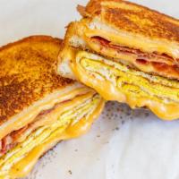 Bacon Egg & Grilled Cheese · 2 eggs, bacon, extra cheese, grilled with butter.