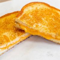 Grilled Cheese · Traditional grilled cheese on white bread.