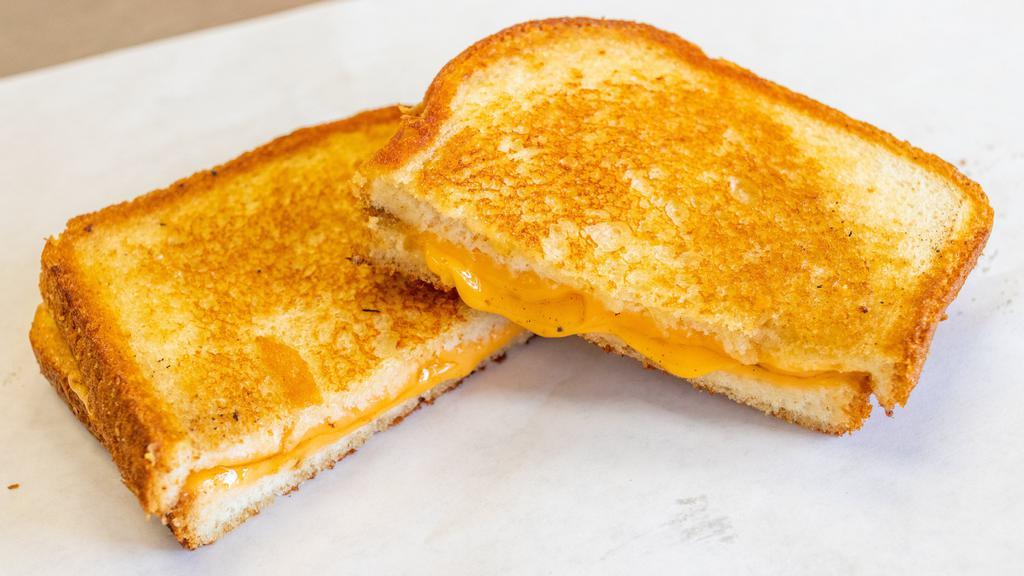 Grilled Cheese · Traditional grilled cheese on white bread.