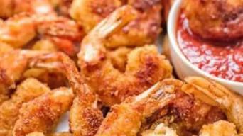 Crispy Shrimp · 4 pieces of fan tailed deep fried shrimp. tail on. comes with a side of sweet and house sauce.