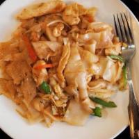 Pad Ke Mow · Flat noodle sauteed with beef or chicken, peppers, onion, and fresh Thai basil.