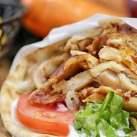 Chicken Gyro Sandwich · Slow, sizzling boneless chicken served in pita bread with bz grill sauce and vegetables. Ser...