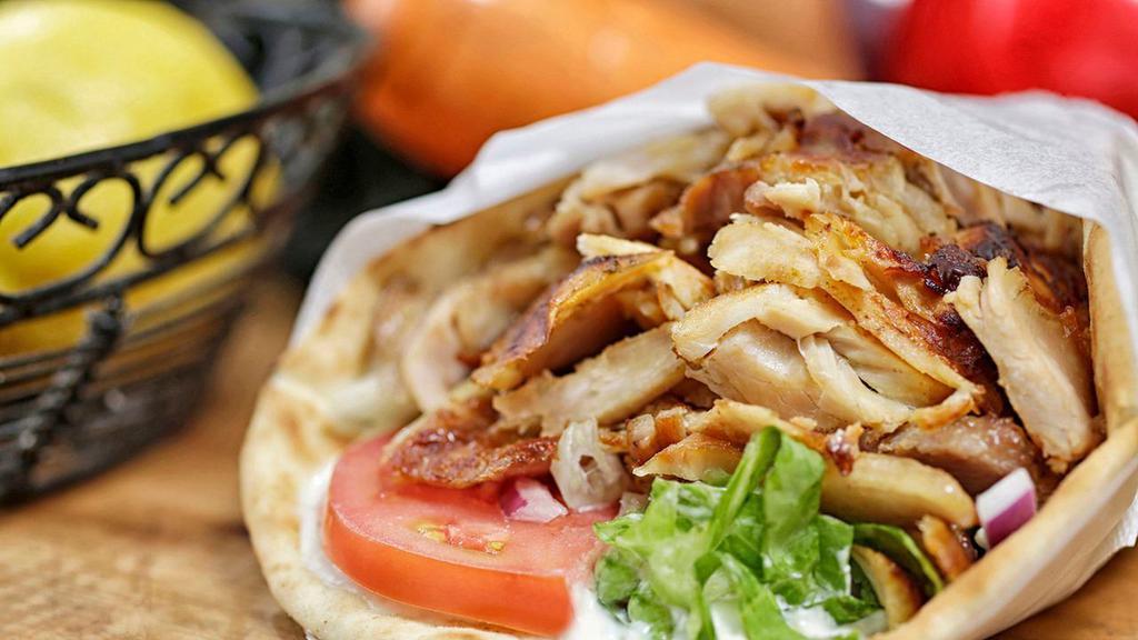 Chicken Gyro Sandwich · Slow, sizzling boneless chicken served in pita bread with bz grill sauce and vegetables. Served with lettuce, tomatoes, onions and pita bread.