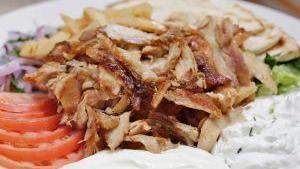 Chicken Gyro Platter · Slow sizzling boneless chicken served with bz grill sauce, lettuce, tomatoes, onions with pi...