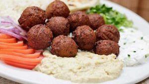 Falafel Platter · Homemade falafel with Mediterranean spices served with lettuce, tomatoes, onions, pita bread hummus and choice of side.