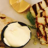 Halloumi · Cypriot goat cheese grilled to perfection served with bz grill sauce and pita bread.