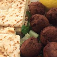 Falafel · Homemade falafel with Mediterranean spices served with hummus and pita bread.