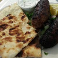 Seftalia · Two pork sausages marinated with cinnamon and mint. A Cypriot special served with tzatziki a...