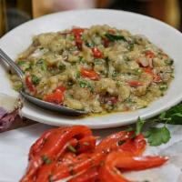Eggplant Salad Spread · Homemade eggplant salad with onion, garlic, roasted peppers and olive oil. Served with pita ...