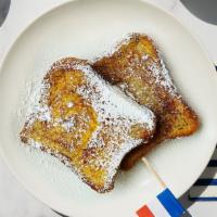 Le Classique French Toast · Say “Bonjour!” to a classic. Thick slices of soft and spongy bread dipped in egg, cream, cin...