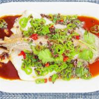 Steamed Whole Fish With Asian Chili. · Whole tilapia steamed and topped with Asian chili peppers