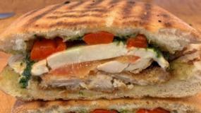 The Calabrese Panini · Melted Fresh mozzarella, sweet peppers, tomatoes, basil, and extra virgin olive and oil. Ser...