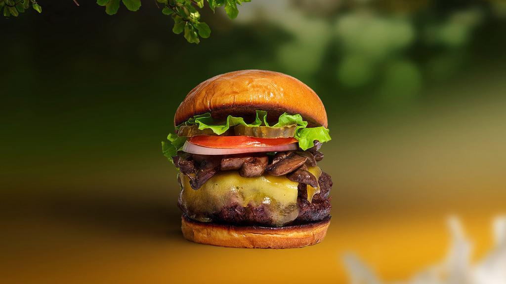 Vegan Mushroom & Cheese Burger · Seasoned vegan burger patty topped with mushrooms, melted vegan cheese, lettuce, tomato, onion, and pickles.