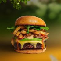 Vegan French Fries Burger · Seasoned vegan burger patty topped with fries, avocado, melted vegan cheese, caramelized oni...
