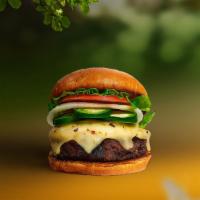 Vegan Jalapeño Burger · Seasoned vegan burger patty topped with melted vegan cheese, jalapenos, lettuce, tomato, oni...