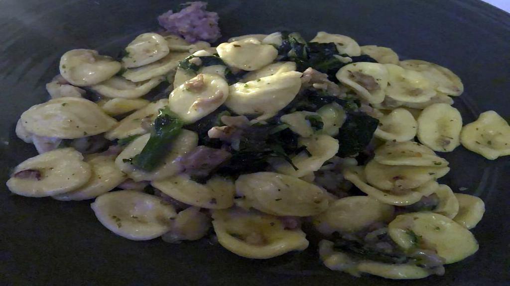 Orecchiette Alla Barese · Homemade ear shaped pasta with broccoli rabe, sausage and garlic.