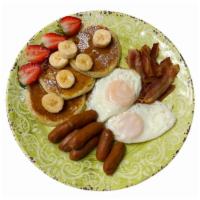 Eggs, Bacon, Sausage And Pancakes · Two eggs served with bacon, sausage and pancakes.
