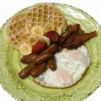 Eggs, Bacon, Sausage And Waffle · Two eggs served with bacon, sausage and waffles.
