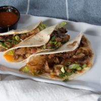 Bbq Short Rib Taco · Short Rib, BBQ sauce, caramelized onions, avocado salsa (3 Tacos)