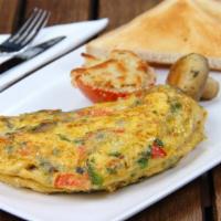 The Greek Omelette · Fresh scrambled eggs, olives, feta cheese, cherries, and tomatoes.