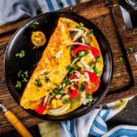 The Santa Fe Omelette · An omelette served with scrambled eggs, onions, jalapeños, cilantro and cheddar cheese.