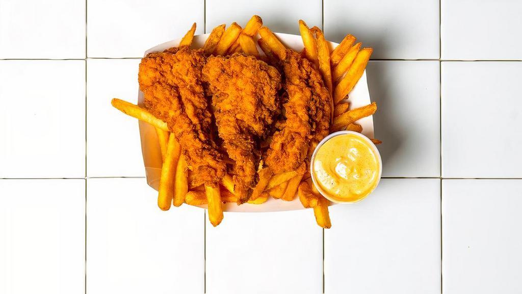 3 Piece Tenders & Fries · 3 Piece Tenders served over fries with a choice of sauce.