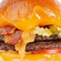 Double Bacon Cheeseburger  · 2 Patties, American & Aged Cheddar, Dill Pickles, Bacon, Tomato & Burger Sauce.