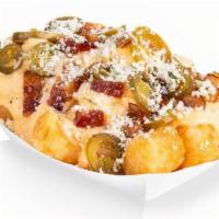 Loaded Tots · Bacon, Cheery Peppers, Herbed Parmesan, Melt Sauce & Cheese Sauce.