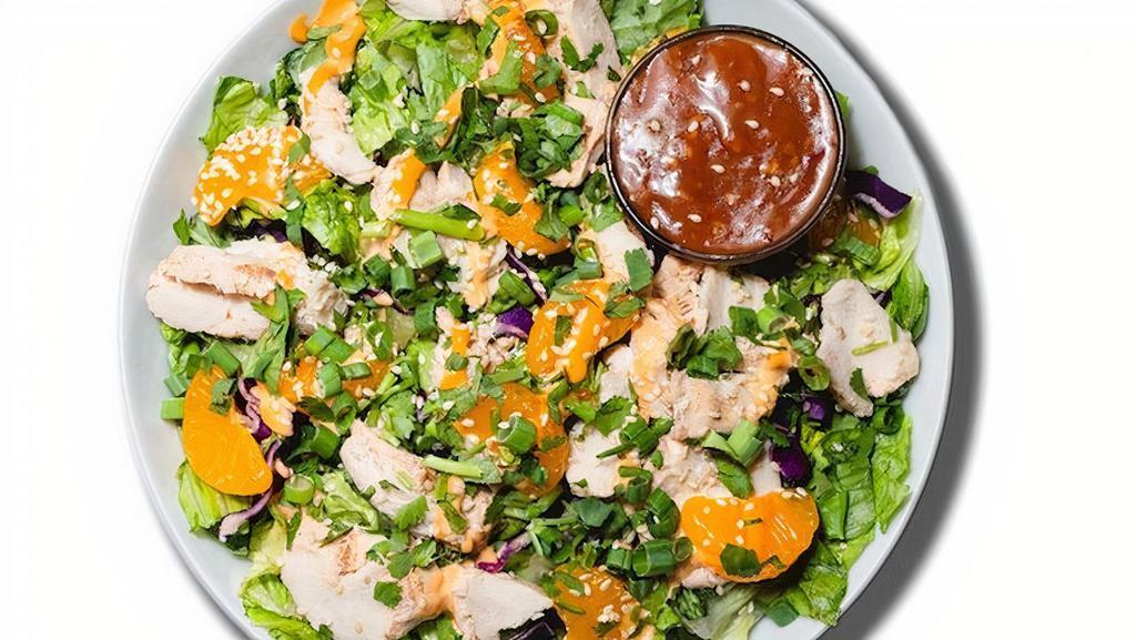 Asian Grilled Chicken Salad · Grilled Chicken, Mandarin Orange, Green Onions, Cilantro, Sesame Seeds & Mandarin Orange Chipotle Sesame Ginger Dressing on Romaine.