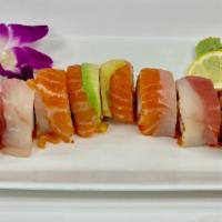 Rainbow · Crab, tobiko, cucumber topped with salmon, tuna, white tuna and avocado.