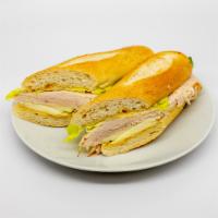 Turkey Brie & Apple Ficelle · Turkey, Brie cheese, granny smith apple, honey mustard and green leaf lettuce on a ficelle.
