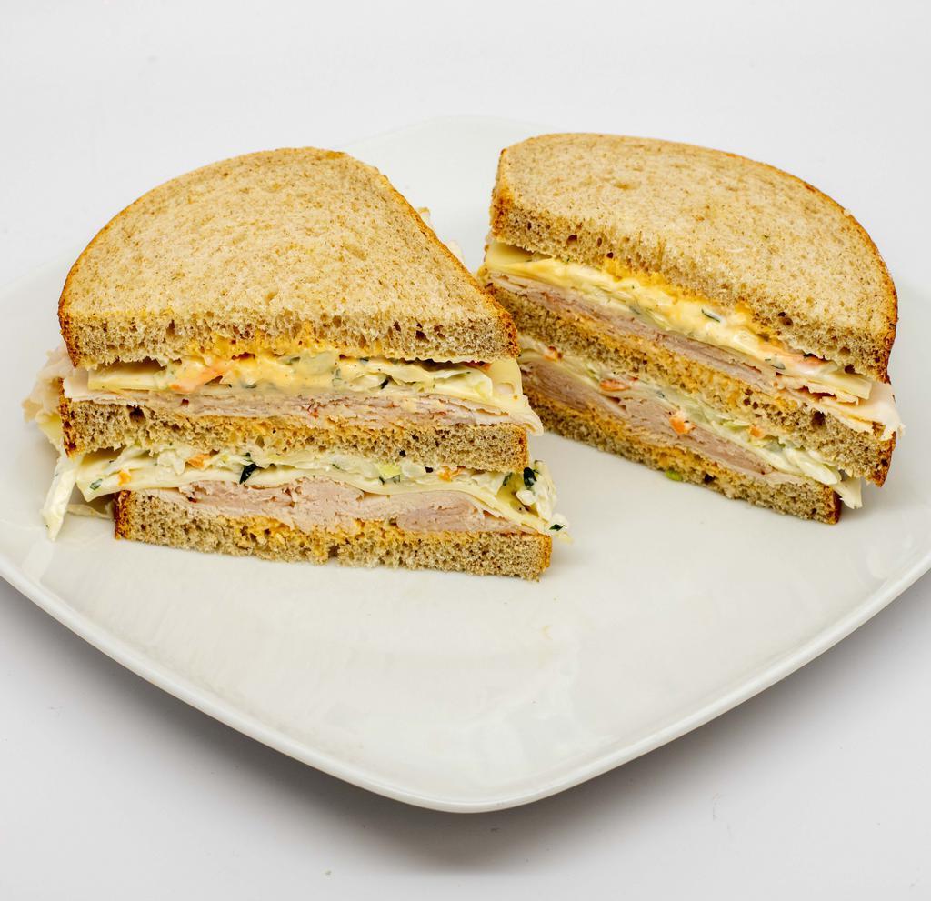 Turkey Sloppy Joe · Turkey breast, Swiss cheese, coleslaw and Russian dressing on rye bread.