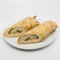 Cranberry, Turkey & Swiss Wrap · Roasted turkey, Swiss cheese, green leaf lettuce and cranberry mayo on a whole wheat wrap.