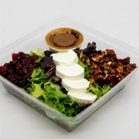 Chevre Spring Mix Salad · Goat cheese, dried cranberries, candied walnuts and balsamic vinaigrette over spring mix.
