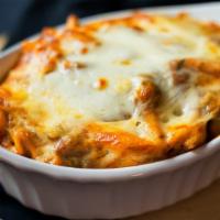 Baked Ziti · Ziti pasta, our house marinara sauce and mozzarella cheese baked until bubbling and golden b...