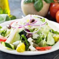 House Salad · Crisp fresh romaine or iceberg lettuce topped with ripe tomatoes, red onions, black olives a...