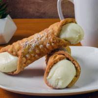 Cannoli · Delicate, fried pastry dough tubes, filled with sweet, creamy ricotta and a dusting of powde...