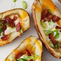 Potato Skins · Three pieces. Filled with sour cream and bacon or jalapeños with sour cream on the side.