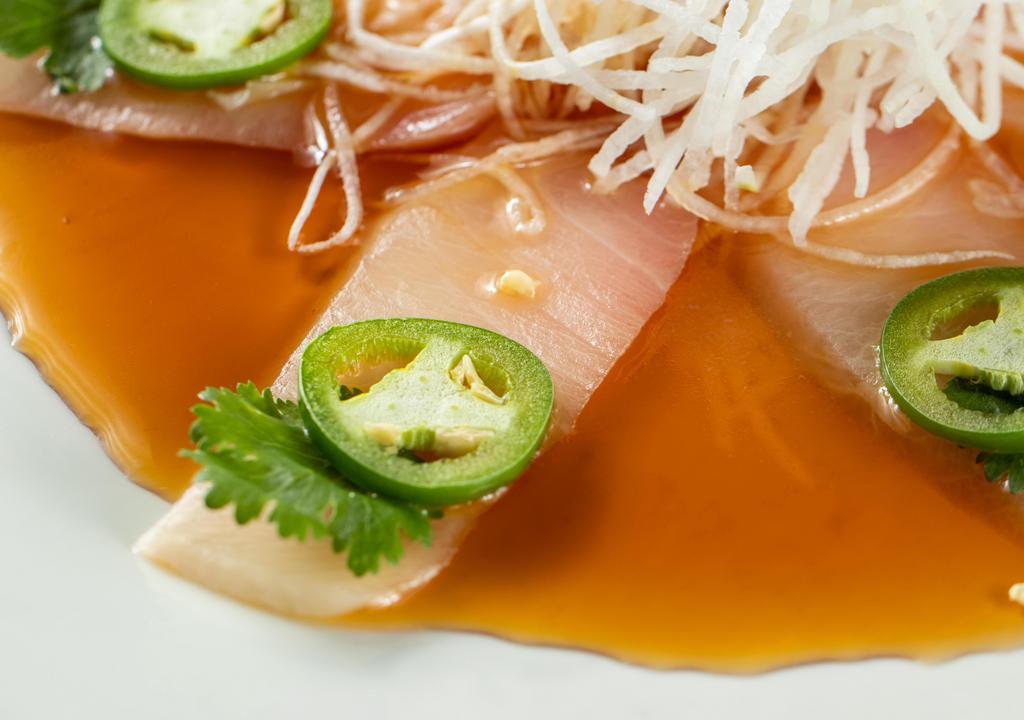 Jalapeño Yellowtail Sashimi · Sliced jalapeno, cilantro, yuzu ponzu.