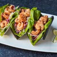 Shrimp Tacos · Sautéed shrimp tossed in angry butter, chipotle mayo, asian slaw, wrapped in butter lettuce ...
