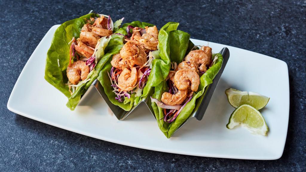 Shrimp Tacos · Sautéed shrimp tossed in angry butter, chipotle mayo, asian slaw, wrapped in butter lettuce leaves.