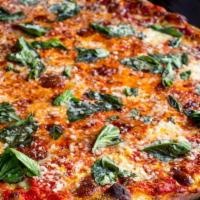 Margherita · Olive oil, plum tomato, fresh basil and a blend of cheeses.