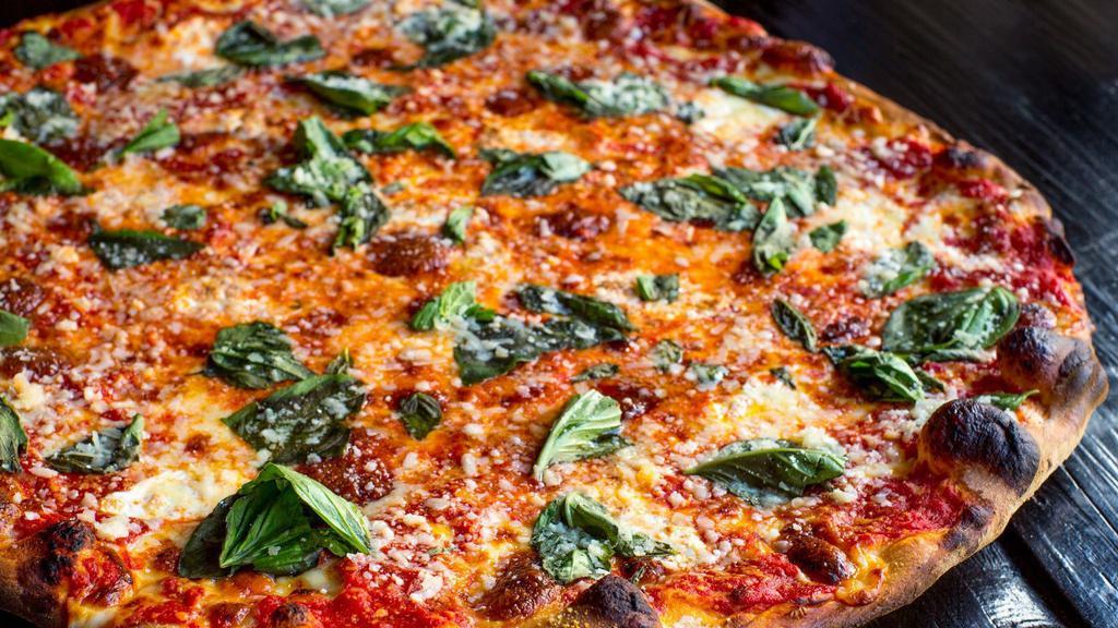 Margherita · Olive oil, plum tomato, fresh basil and a blend of cheeses.